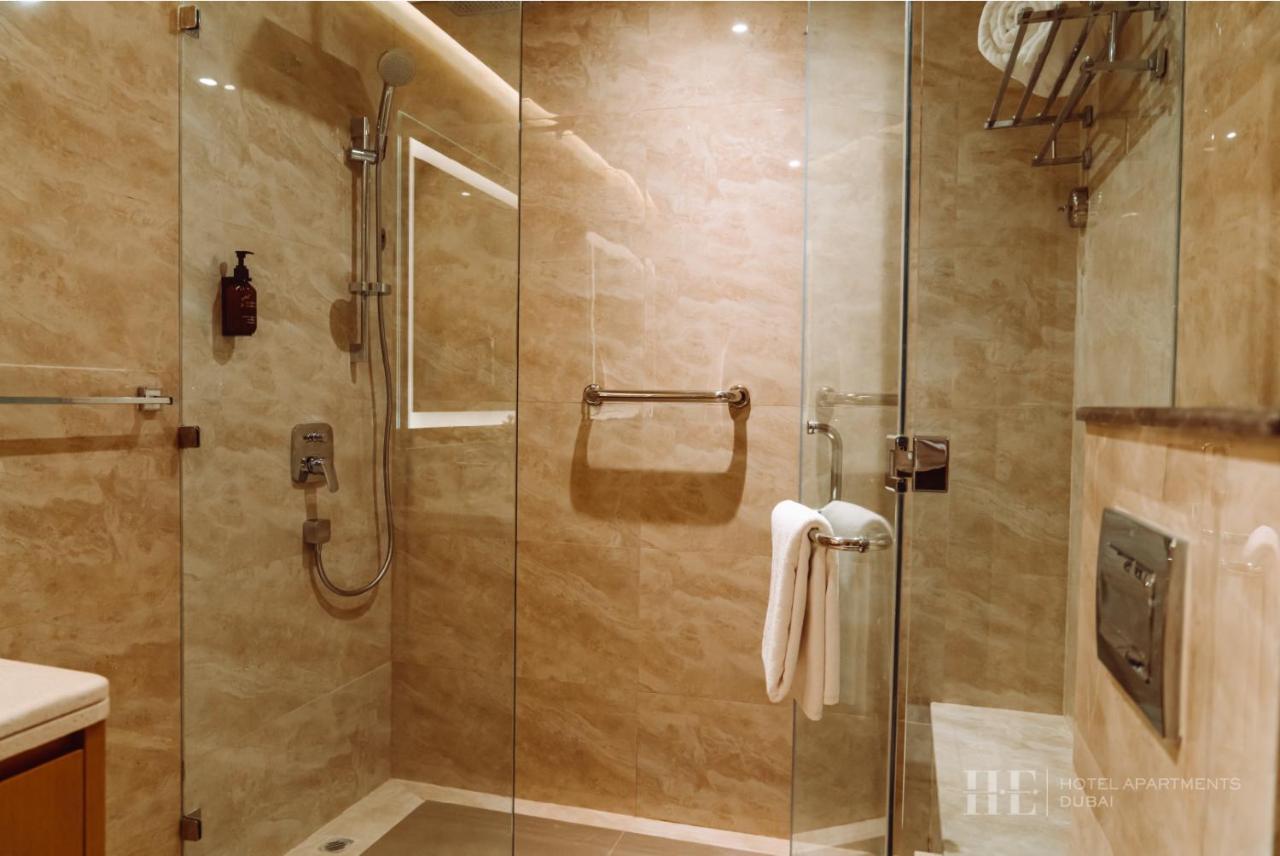 He Hotel Apartments Dubai Room photo A shower cubicle